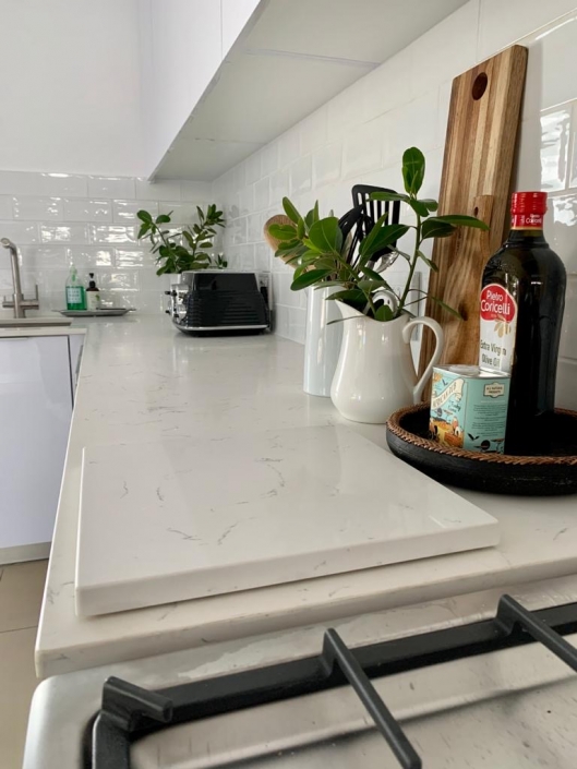 Kitchen renovation with white counter tops White kitchen Slab